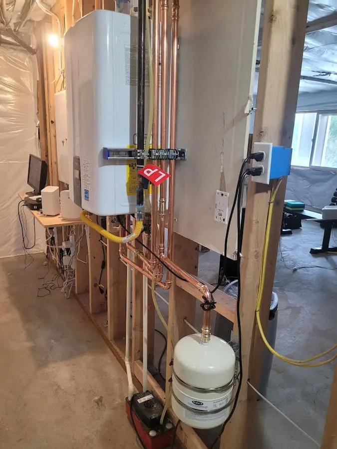 Licensed plumber repairing a kitchen sink in Kent